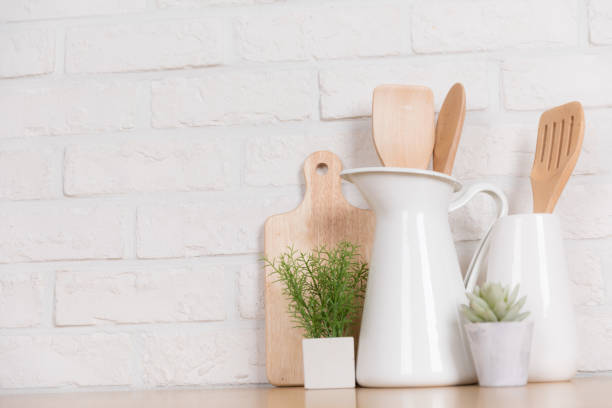 istock Kitchen utensils and dishware on wooden shelf. Kitchen interior background.Text space. 1019895334