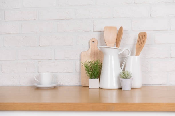istock Kitchen utensils and dishware on wooden shelf. Kitchen interior background.Text space. 1019895336