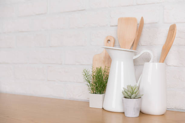 istock Kitchen utensils and dishware on wooden shelf. Kitchen interior background.Text space. 1019895354