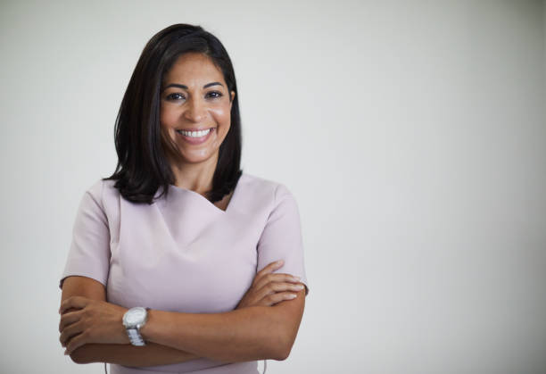 Studio headshot of beautiful Brazilian woman. Studio headshot of Brazilian businesswoman on grey background.
lifestyles in Sydney Australia woman arms folded stock pictures, royalty-free photos & images