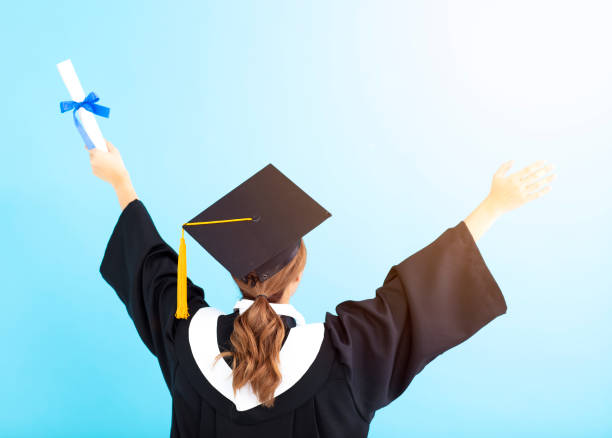 istock rear view graduate student holding diploma isolated 1019914120