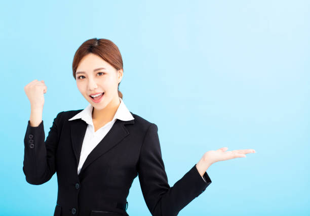 istock happy business woman doing winner gesture 1019914726