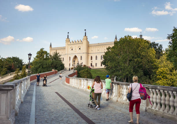 Lublin, Poland - Jul 27, 2018: Royal Castle of Lublin, bridge with tourists. The Lublin Castle is a medieval castle in Lublin adjacent to the Old Town district and close to the city center
