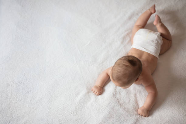 istock Newborn baby trying to rollover 1019921734