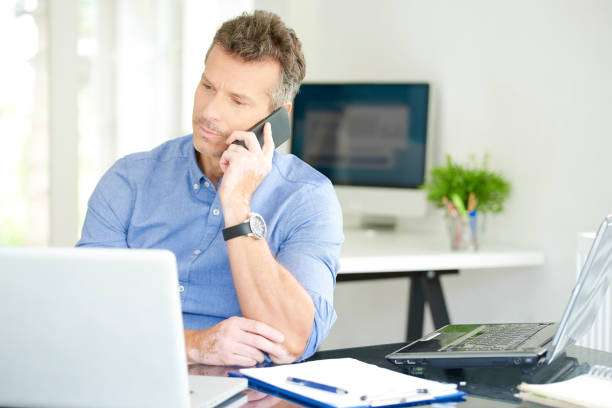 istock Businessman with mobile phone and notebook in the office 1019923256