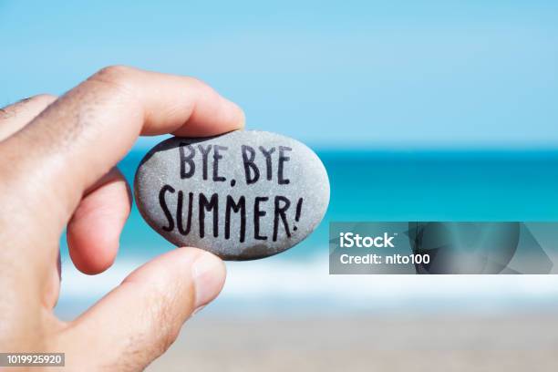 Man On The Beach And Text Bye Bye Summer Stock Photo - Download Image Now - Summer, The End, Goodbye - Single Word