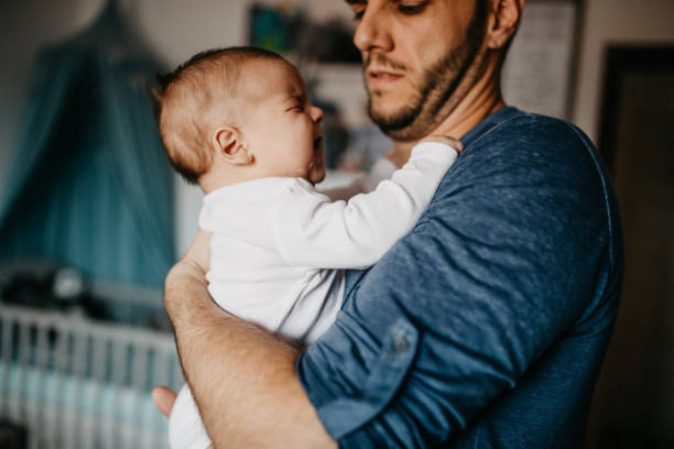 istock Dad soothe crying colic baby 1019928738