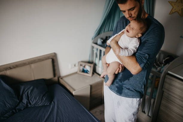 istock Dad soothe crying colic baby 1019929774