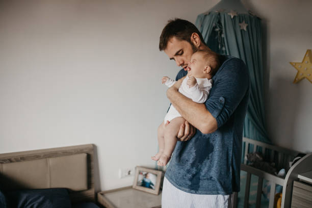 istock Dad soothe crying colic baby 1019929934
