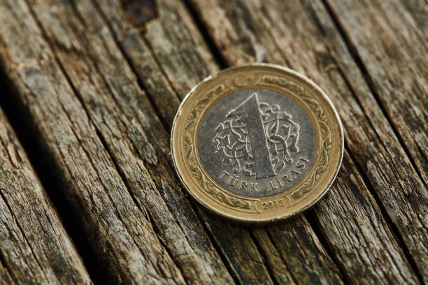 istock One Turkish Lira on wooden table 1019939608