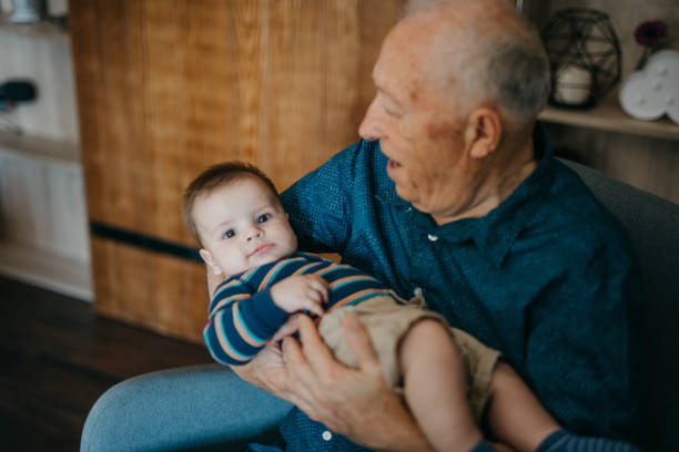 istock Grandfather hold grandson happily 1019946358