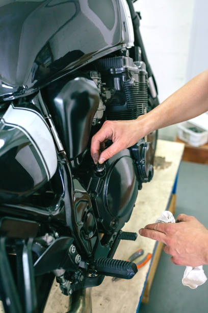 istock Mechanic repairing customized motorcycle 1019948952