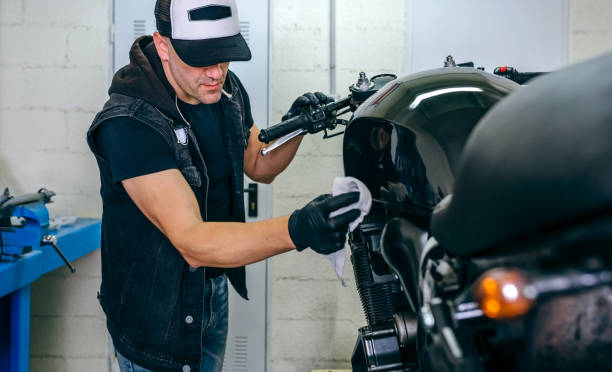 istock Mechanic cleaning a motorcycle 1019948980
