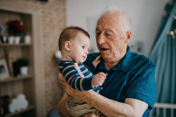 istock Grandpa embracing his little grandson 1019949556