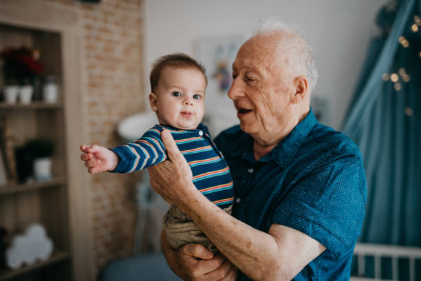 istock Grandpa embracing his little grandson 1019949558