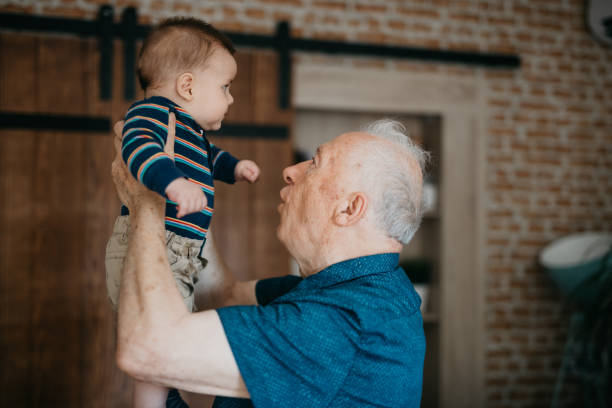 istock Grandfather playing with his grandson 1019949640