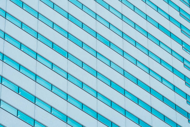 istock Beautiful exterior building with glass window pattern textures 1019950078