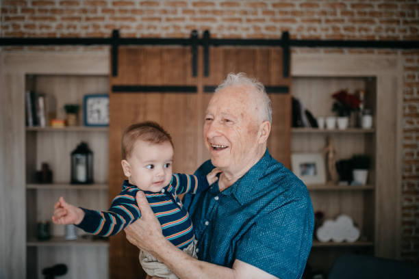 istock Proud grandfather holding his grandson 1019951062