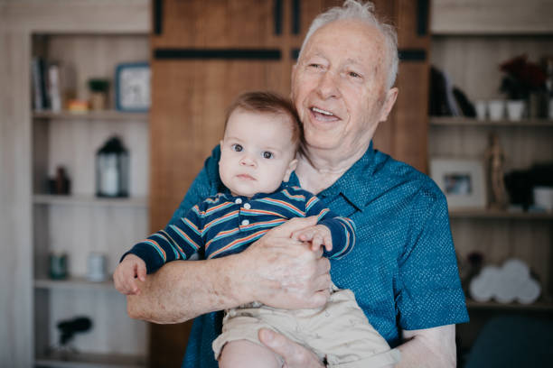 istock Proud grandfather holding his grandson 1019951118