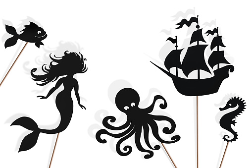 Shadow puppets of mermaid, kraken, sailing ship, fish and sea horse, isolated on white background.