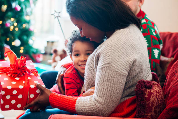 istock Gift Giving with his Mother on Christmas Morning 1019954770