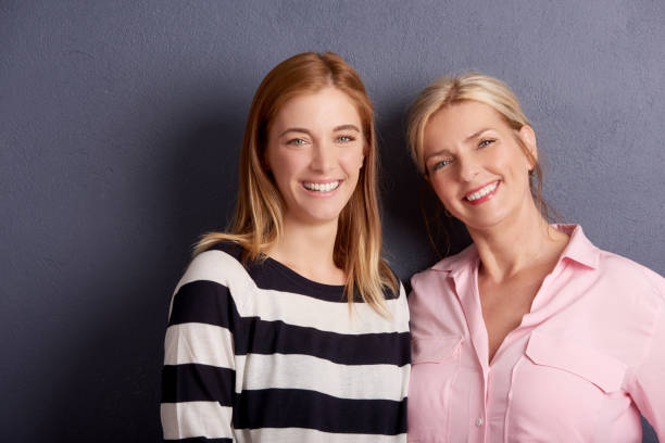 istock Beautiful mother and daughter studio shot 1019955030