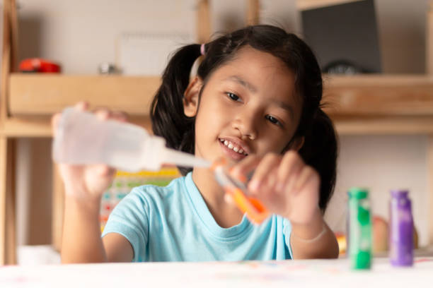 istock The little asian whim is testing color on the table 1019955486