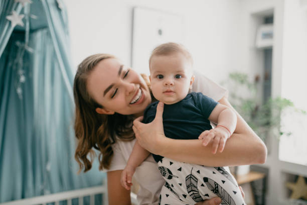 istock Mom holding her little baby boy 1019963894
