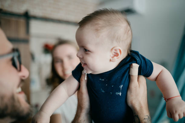 Baby Spit Up Curdled Milk and smiling