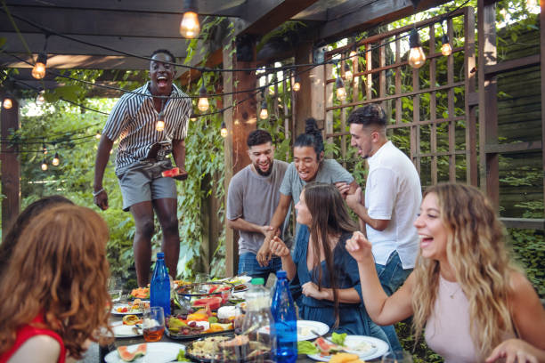 istock Multi-ethnic friends enjoying dinner together 1019966118
