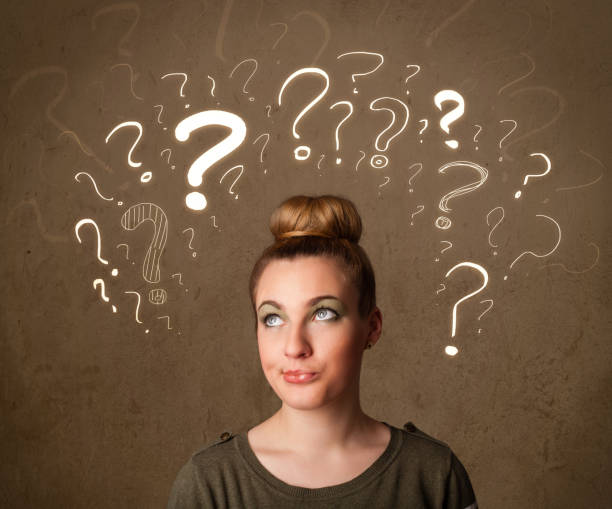 istock girl with question mark symbols around her head 1019967260
