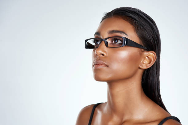 Studio shot of a beautiful young woman posing against a light background