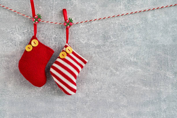 istock Christmas background. Red Christmas socks on gray background. Copy space. 1019982148