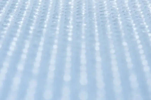 Full frame plastic bubble wrap abstract background image suitable for business, science, technology, engineering, maths.
