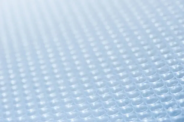 Full frame plastic bubble wrap abstract background image suitable for business, science, technology, engineering, maths.