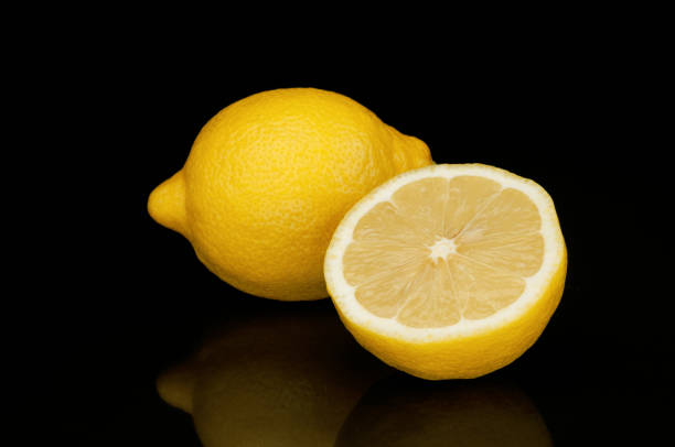 istock Sour lemon isolated on black background 1019983326