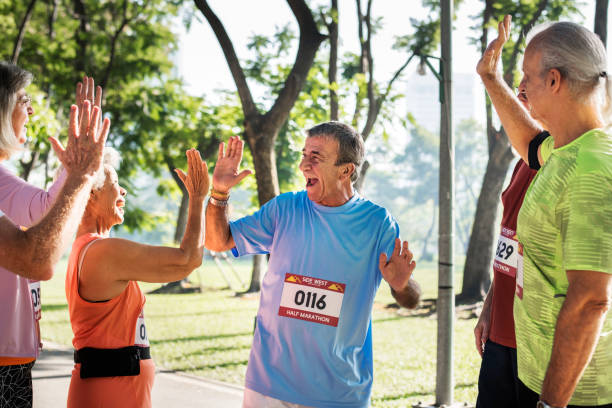 istock Group of senior athletes giving a high five 1019990066