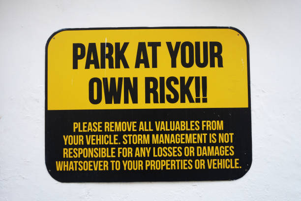 istock Park at your own risk sign on wall 1019995808