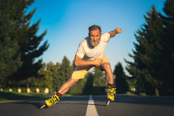 istock The old man rollerblading on the asphalt 1019996266