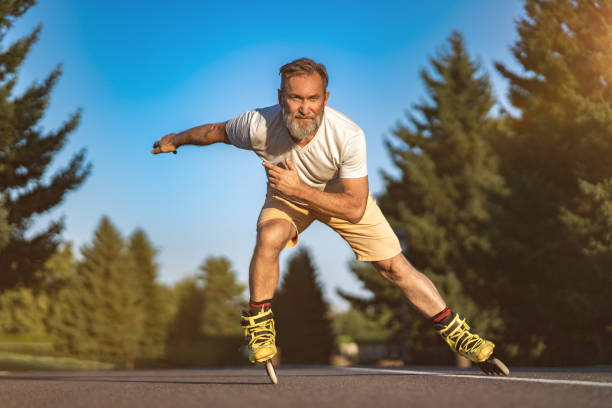 istock The old man rollerblading on the road 1019996284
