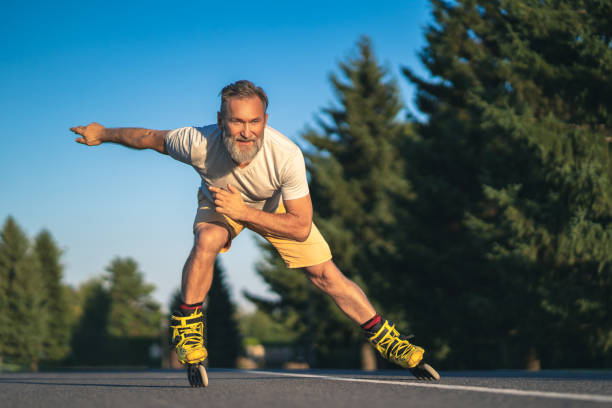 The old man rollerblading on the alley