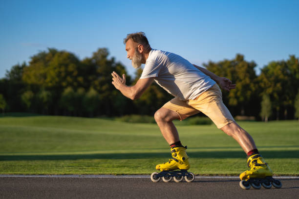 istock The elderly man rollerblading on the alley 1019996338