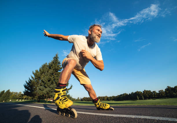 istock The old man rollerblading on the road 1019998702