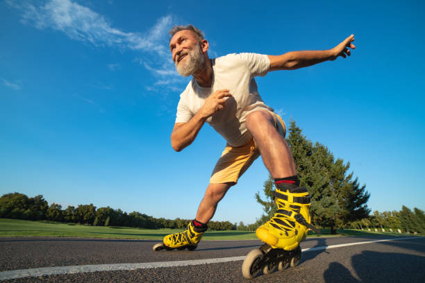 istock The elderly man rollerblading on the road 1019998728