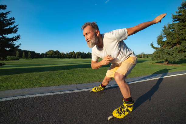 istock The elderly man rollerblading on the alley 1019999906