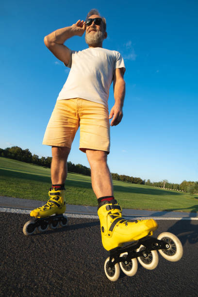 istock The man in sunglasses standing in rollers on the road 1020000872
