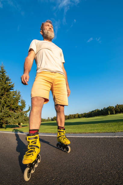 istock The elderly man in rollers standing on the road 1020000910