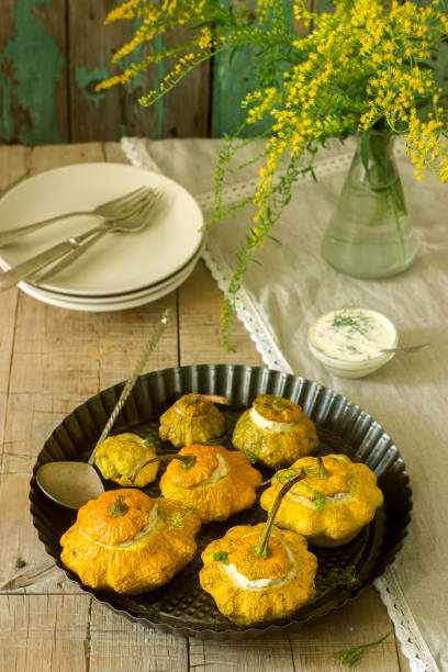 istock Pattypan squash or pumpkins stuffed with ricotta with basil and dill and served with sour cream sauce. Vegetarian food. 1020002038