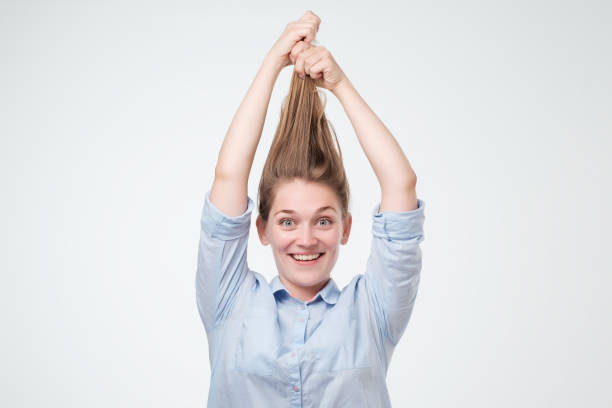istock Attractive woman holding he long hair up. 1020002654