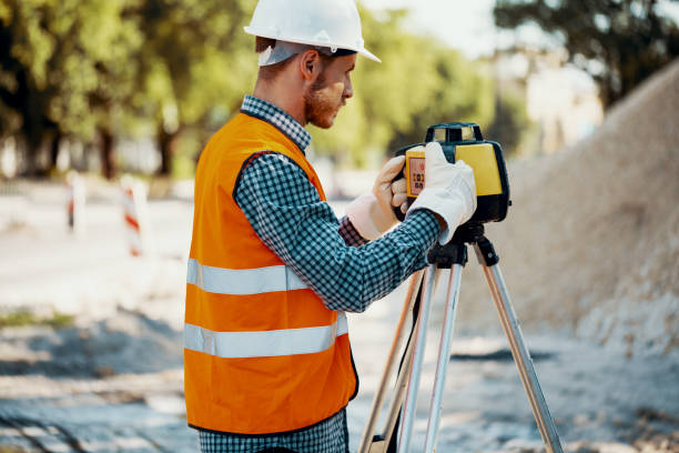 istock Engineer in reflective vest and white helmet using geodetic equipment 1020004744